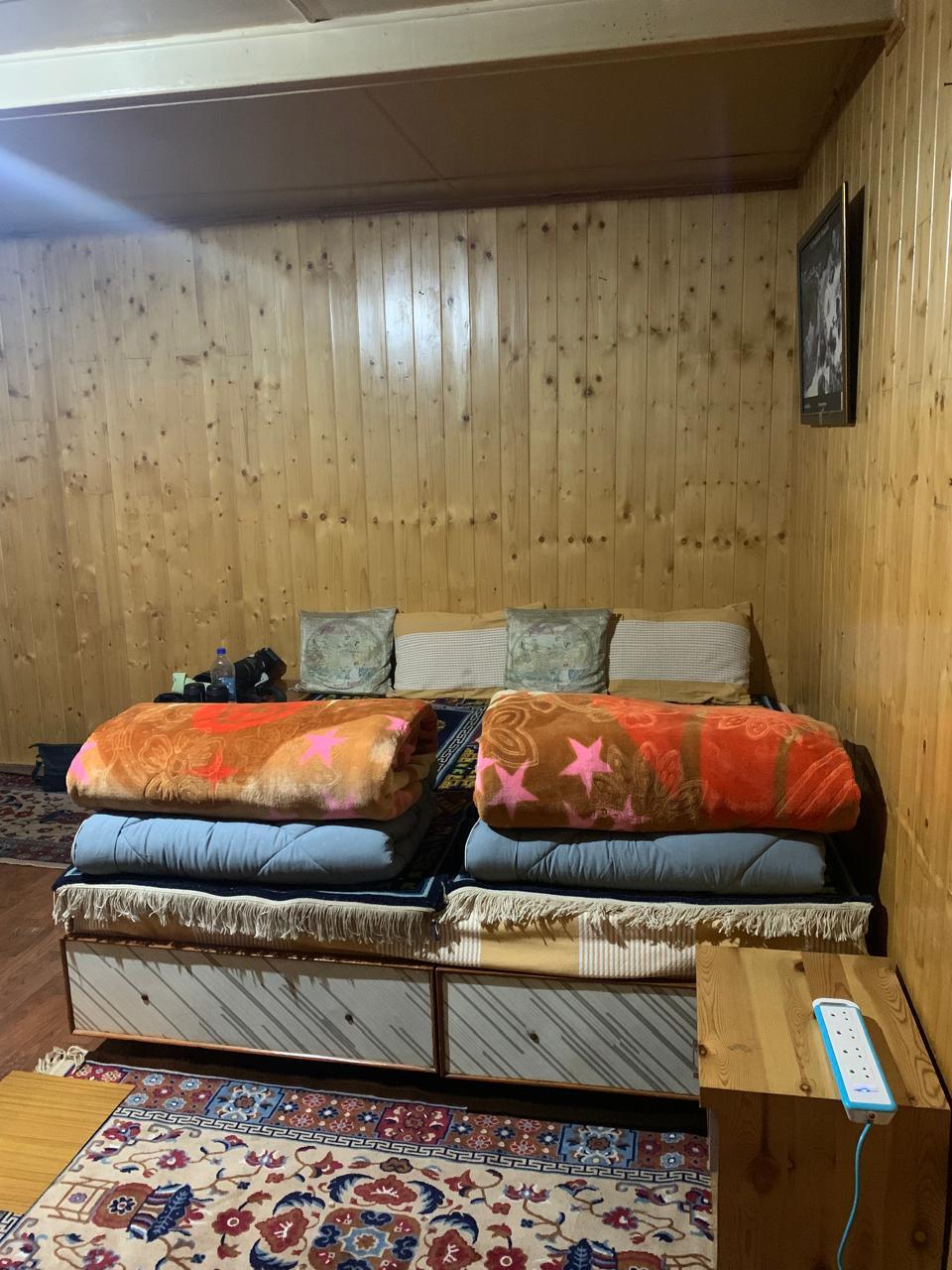 A homestay bedroom, with warm blankets laid out